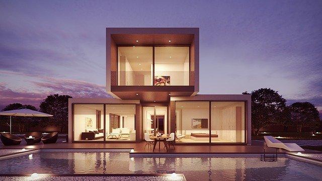 Casa de cubo con piscina al aire libre con diferentes luces led alrededor de la piscina